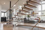 Staircase, Glass Railing, and Wood Tread  Photo 7 of 17 in Bent Glass Freestanding Staircase by John Flagg