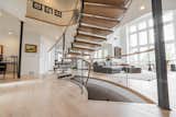 Staircase, Glass Railing, and Wood Tread  Photo 8 of 17 in Bent Glass Freestanding Staircase by John Flagg