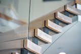 Staircase, Glass Railing, and Wood Tread  Photo 15 of 17 in Bent Glass Freestanding Staircase by John Flagg