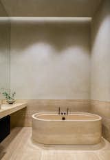 Bath Room, Tile Counter, Freestanding Tub, and Travertine Floor  Photo 12 of 16 in Death Star Loft by RAAD Studio