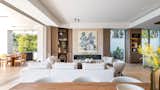 Floor-to-ceiling windows with minimal frames draw the outside in and open up to the ocean facing terrace with outdoor kitchen and pool with built-in jacuzzi, blurring the lines between the out- and indoors.