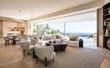 This space houses a formal living room, dining room, family room and kitchen. 