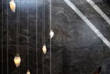 A custom cascading chandelier by Canadian designer Randy Zieber in sand-cast bronze and alabaster.