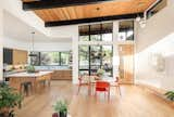 Dining Room, Bar, Stools, Pendant Lighting, Table, Chair, Ceiling Lighting, and Light Hardwood Floor  Photo 3 of 19 in Scandinavian Mid-Mod Ranch by Clark Thomas