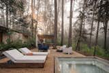 The terrace contains a built in jacuzzi, as well as a grill area and open dining area.