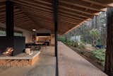 The gabled roof extends the house lecture from the inside into the outside porch.