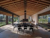 The dining and living areas are virtualy contained by a steel chimney.
