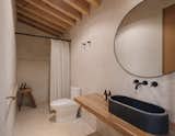 The bathrooms are simple and clean, with stucco covering every surface but the ceiling.