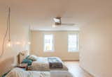 Bedroom, Medium Hardwood Floor, Night Stands, Bed, Lamps, Pendant Lighting, Table Lighting, and Ceiling Lighting  Photo 9 of 19 in 211 Warren Street by CTA Architects P.C.