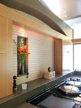 Kitchen, Range, Wood Cabinet, Accent Lighting, Ceramic Tile Backsplashe, Ceiling Lighting, and Engineered Quartz Counter  Photo 18 of 58 in Modern Copper Home in Missouri by Bjella Architecture