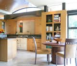 Modern kitchen with arched wood ceiling