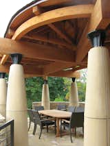 Outdoor dining pavilion structure of heavy timber, steel, and cast concrete columns