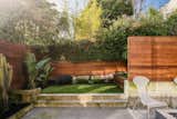 Outdoor, Raised Planters, Trees, Wood Fences, Wall, Concrete Patio, Porch, Deck, Small Patio, Porch, Deck, Concrete Fences, Wall, and Back Yard The Yard and Patio  Photo 6 of 11 in Sanchez: Urban Estate in the Heart of Noe Valley by Anna Ortiz