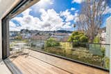 Outdoor, Large Patio, Porch, Deck, Decking Patio, Porch, Deck, Trees, Wood Patio, Porch, Deck, and Horizontal Fences, Wall Penthouse Deck Views  Photo 9 of 11 in Sanchez: Urban Estate in the Heart of Noe Valley by Anna Ortiz