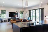 Kitchen, Medium Hardwood Floor, Engineered Quartz Counter, Recessed Lighting, Colorful Cabinet, Ceiling Lighting, Undermount Sink, Cooktops, Pendant Lighting, and Wood Backsplashe Kitchen/Dining/Living  Photo 3 of 7 in Quincy Quarries by MASS Architect