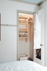 Storage Room and Closet Storage Type My husband built my custom closet organization design out of pine for both of the small, but mighty, closets.   Photo 13 of 28 in Cottage on Maybell by Maddie Hamilton