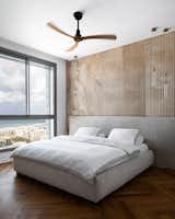 Bedroom, Bed, Medium Hardwood Floor, and Ceiling Lighting  Photo 14 of 20 in Sahara apartment by Studio Shemesh