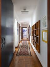 The corridor that links the living room and the bedrooms receives light from the television station.