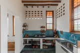 Kitchen - Jalis at the top allow to heat to escape also traditional elements wood-fired kitchen, mud fridge 