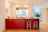Kitchen, Medium Hardwood Floor, Metal Counter, Colorful Cabinet, Wall Lighting, and Drop In Sink Frontal view of the kitchen  Photo 1 of 9 in Interior renovation of a classic Dutch house by Camilla Casiccia