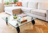 Living Room, Coffee Tables, Sofa, and Medium Hardwood Floor Living room, Gae Aulenti coffee table with objects from local designers  Photo 8 of 9 in Interior renovation of a classic Dutch house by Camilla Casiccia