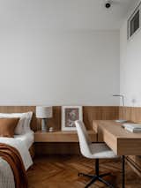 Bedroom, Shelves, Light Hardwood Floor, Table Lighting, and Lamps A wall panel creates a unified composition of the bed's headboard and the desk  Photo 1 of 11 in New Life of a 80 m2 Moscow Apartment by Static Aesthetic Architects by Static Aesthetic Architects