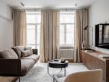 Living Room, Sofa, Floor Lighting, Console Tables, Chair, Ceiling Lighting, and Light Hardwood Floor A cozy living room.  Photo 9 of 11 in New Life of a 80 m2 Moscow Apartment by Static Aesthetic Architects by Static Aesthetic Architects