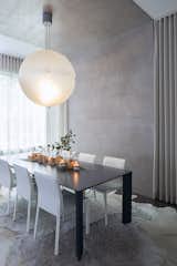 Dining Room, Table, Chair, Pendant Lighting, Rug Floor, and Dark Hardwood Floor  Photo 2 of 10 in Bucktown Project by Real Talk Interiors