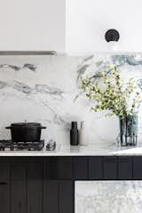 Kitchen, Wood Cabinet, Range, Marble Backsplashe, Marble Counter, and Wall Lighting Kitchen  Photo 3 of 10 in McNeill House by ARYZE Developments Inc.