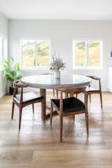 Dining table featuring a RH 60” table and wingback chairs 