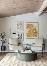 Living Room, Dark Hardwood Floor, End Tables, Ottomans, Wall Lighting, and Chair Den gallery wall  Photo 2 of 13 in Midcentury Retro Revival by Studio Connolly