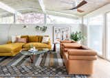 Living Room, Chair, Coffee Tables, Sofa, Floor Lighting, Ceiling Lighting, Dark Hardwood Floor, Sectional, and End Tables Living room  Photo 5 of 13 in Midcentury Retro Revival by Studio Connolly