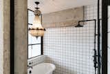 Bath Room, Pendant Lighting, Ceramic Tile Wall, Freestanding Tub, Open Shower, and Subway Tile Wall En suite spa bath; porcelain claw-foot tub with heritage Hudsons' Bay chandelier  Photo 5 of 15 in The Artists' Penthouse by Molly Lowe