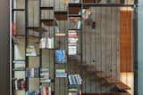 A quirky handrail doubles up as a book-case