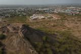 The science Centre, designed with a vernacular aesthetic, merges with the landscape, sitting unobtrusively, with the city forming a backdrop