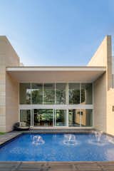 A pool at the back of the house provides a space for relaxation and recreation