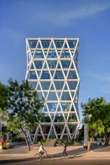 The building optimizes spatial utilization, champions sustainability, and resonates with the brand's essence
