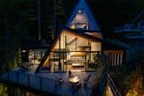 Outdoor, Small Pools, Tubs, Shower, Concrete Patio, Porch, Deck, Rooftop, and Raised Planters Cutting dramatic angles at dusk.  Photo 3 of 10 in Alpine A-Frame by Marie-Joelle Marceau