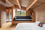 A kid's bedroom is designed with versatility for storage, play, and sleepovers.  