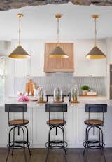 Kitchen, Range, Accent Lighting, White Cabinet, Range Hood, and Mosaic Tile Backsplashe  Photo 7 of 10 in Goldsmith by Inside Stories