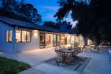 Exterior, Stucco Siding Material, House Building Type, Shingles Roof Material, Gable RoofLine, and Mid-Century Building Type Exterior Back Yard at Night  Photo 6 of 15 in Mandeville Canyon - Mid Century Modern Revamp by Mark Nichols - MNichols Design