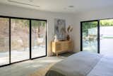 Primary Bedroom Suite with Large Sliding Doors out to the Back Yard with Views of Mandeville Canyon