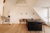 Kitchen, Wall Oven, Wood Cabinet, Laminate Counter, Drop In Sink, Medium Hardwood Floor, Dishwasher, Wall Lighting, Laminate Cabinet, Refrigerator, Cooktops, and Wood Counter kitchen area  Photo 2 of 19 in Amsterdam Loft by ardor studio