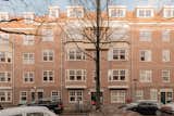 Exterior, Brick Siding Material, Tile Roof Material, Apartment Building Type, and A-Frame RoofLine Exterior of the building  Photo 1 of 19 in Amsterdam Loft by ardor studio