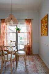 Dining Room, Table, Accent Lighting, Pendant Lighting, Rug Floor, Chair, and Ceramic Tile Floor  Photo 2 of 7 in Midcentury Flair takes on Small Town Texas by Aften Lane