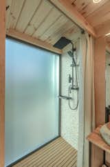 Bath Room, Light Hardwood Floor, Mosaic Tile Wall, Open Shower, Ceiling Lighting, and Vessel Sink Shower time  Photo 3 of 10 in Unitfab Imagine in the Kyiv Region: Where Innovation Meets Nature by Naya Novak