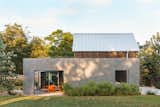 Exterior Side Angle Side Architects create a concrete wall for privacy  Photo 1 of 8 in Harvey ADU by Side Angle Side