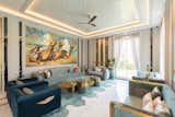 The family lounge follows the same theme with bespoke sofas and a captivating coffee table. Wall panelling with brass accents imbues a touch of intrigue to the space while a painting contributes to the traditional sense.

