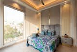 The other bedroom follows a minimal palette with grey hues and textile furnishings evoking the essence of traditionalism in modern design.
