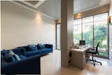 Zoned across five storeys, including two basements, the office space meets the requirements of the clients and the employees. The second floor is dedicated to individual cabins and meeting rooms, fostering unique aesthetics. The cabin is designed to offer ample natural light with glass windows and simple artificial lighting. A captivating painting along with ergonomic furniture adds to the idea of comfort and professionalism in design.
